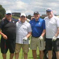 same four men playing golf